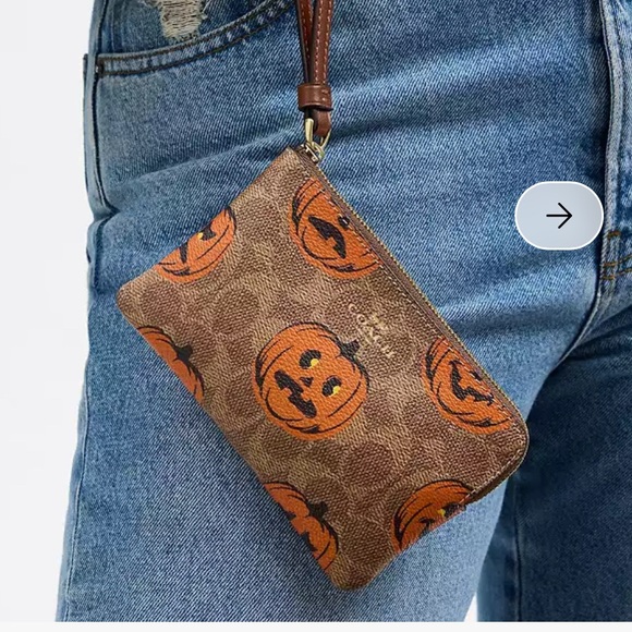 Coach Wristlet new with tags Corner Zip In Signature Canvas w/pumpkins
